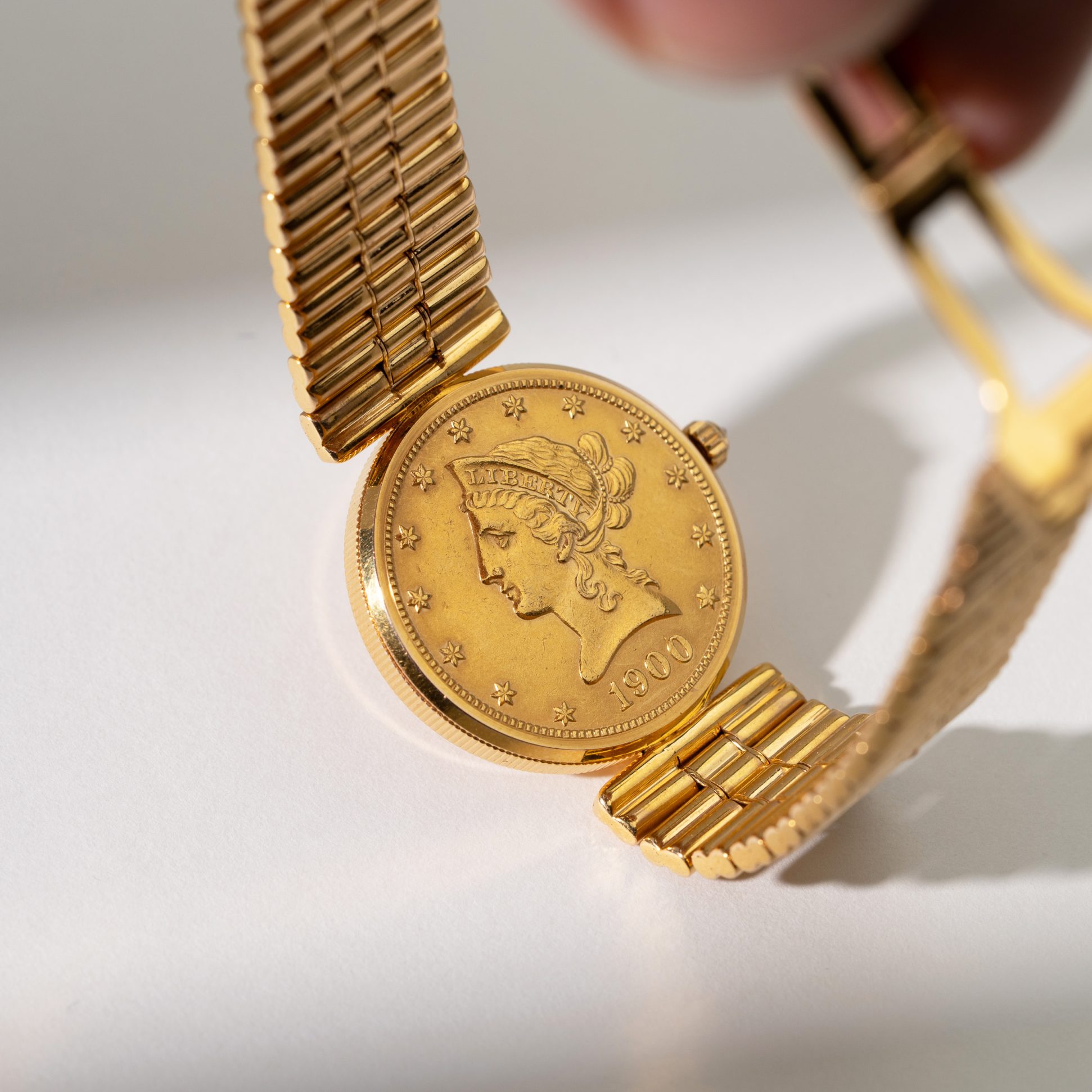 18k Corum Eagle Liberty-head coin watch.